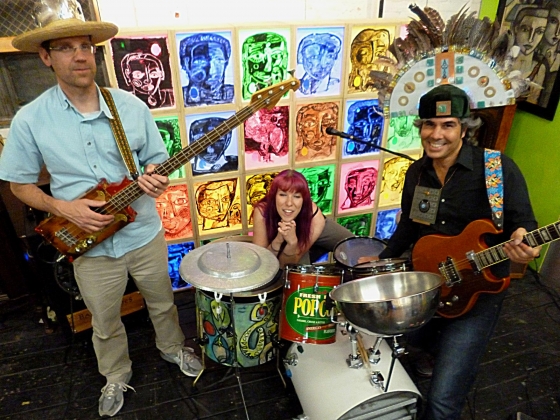 Members of the band Johnny Fireseed posing with instruments