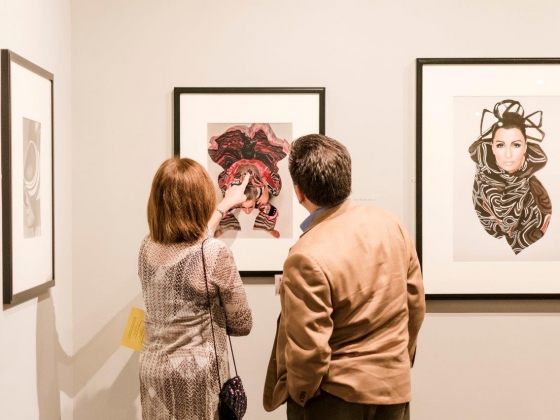 Patrons looking at art