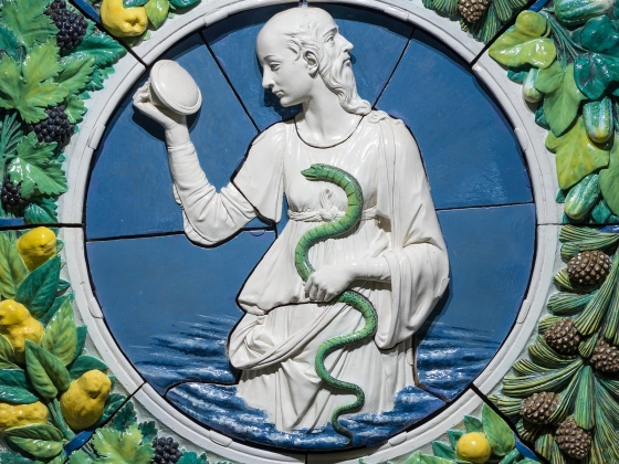 Andrea della Robbia, Prudence, about 1475 Terracotta wreath of lemons and pinecones surrounding two faced figure with serpent in middle